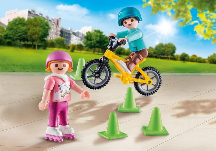 Children with skates and bike